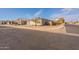 Exterior view of a single-Gathering home, with a manicured lawn and tidy landscaping at 1236 E Silver Reef Dr, Casa Grande, AZ 85122