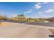 Street view of a well-maintained neighborhood, showcasing lush greenery and clear blue skies at 1236 E Silver Reef Dr, Casa Grande, AZ 85122