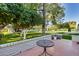 Relaxing backyard featuring citrus trees, lush landscaping, and a charming patio area at 12515 W Prospect Dr, Sun City West, AZ 85375