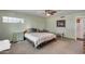 Bedroom featuring a window, ceiling fan, and carpet flooring at 12515 W Prospect Dr, Sun City West, AZ 85375