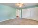 Bedroom boasts neutral carpet, ceiling fan and a double door closet for maximum storage at 12515 W Prospect Dr, Sun City West, AZ 85375