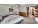 Bedroom with a sliding barn door leading to the bathroom at 12515 W Prospect Dr, Sun City West, AZ 85375