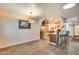 Open-concept dining area with a modern light fixture and seamless access to the kitchen at 12515 W Prospect Dr, Sun City West, AZ 85375