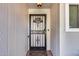 Close-up of an elegant front door with decorative ironwork and a welcoming entrance mat at 12515 W Prospect Dr, Sun City West, AZ 85375