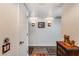 Hallway with wood floors, neutral walls, decorative lighting, and a view into adjacent rooms at 12515 W Prospect Dr, Sun City West, AZ 85375