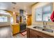 Bright kitchen featuring a center island with a stainless steel range hood and butcher block countertop at 12515 W Prospect Dr, Sun City West, AZ 85375