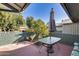 Private patio with a glass table and umbrella, perfect for outdoor entertaining at 12515 W Prospect Dr, Sun City West, AZ 85375