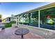 Covered patio featuring a table and view of the yard at 12515 W Prospect Dr, Sun City West, AZ 85375