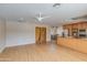 Spacious living room featuring wood floors, natural light, and an open layout with the kitchen at 1301 E Belmont Ave, Phoenix, AZ 85020