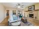 Living room featuring fireplace, ceiling fan, and hardwood flooring at 1301 E Belmont Ave, Phoenix, AZ 85020