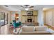 Living room with fireplace, ceiling fan, and seating overlooking the backyard at 1301 E Belmont Ave, Phoenix, AZ 85020