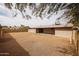 View of the expansive backyard with desert landscaping and covered patio space at 13439 N 16Th Ave, Phoenix, AZ 85029