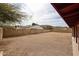 Large gravel backyard enclosed by a block wall at 13439 N 16Th Ave, Phoenix, AZ 85029