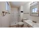 Clean and functional bathroom with white tile, walk-in shower, and vanity at 13439 N 16Th Ave, Phoenix, AZ 85029