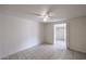 Neutral bedroom featuring tile floors, ceiling fan, and large walk-in closet at 13439 N 16Th Ave, Phoenix, AZ 85029