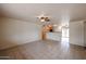 Living room showcases tile flooring and a view into the adjacent kitchen at 13439 N 16Th Ave, Phoenix, AZ 85029