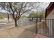 View of the side yard, featuring desert landscaping and a metal fence at 13439 N 16Th Ave, Phoenix, AZ 85029