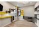 Bedroom featuring a custom-built wall storage with yellow accents, a ceiling speaker and hardwood floors at 13763 N Campsite Ct, Fountain Hills, AZ 85268