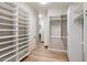 Spacious walk-in closet with custom shelving and storage solutions in a neutral color palette at 13763 N Campsite Ct, Fountain Hills, AZ 85268