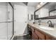 Bathroom features a glass-enclosed shower, granite countertops, and modern fixtures at 14430 W White Rock Dr, Sun City West, AZ 85375