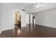 Bedroom with wood floors and ensuite bathroom at 14430 W White Rock Dr, Sun City West, AZ 85375