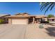 Charming single-story home with a two-car garage and low-maintenance desert landscaping at 14430 W White Rock Dr, Sun City West, AZ 85375