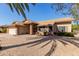 Charming single-story home with a two-car garage and low-maintenance desert landscaping at 14430 W White Rock Dr, Sun City West, AZ 85375