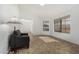 Bright living room with neutral tile, white walls, and comfortable seating at 14430 W White Rock Dr, Sun City West, AZ 85375