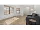 Bright living room with neutral tile, white walls, and comfortable seating at 14430 W White Rock Dr, Sun City West, AZ 85375