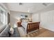 Cozy bedroom featuring a wooden bed frame, soft lighting, and ample closet space at 15229 E Marigold Ct, Fountain Hills, AZ 85268