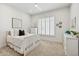 Bright bedroom with white furniture, carpet flooring, plantation shutters, and modern decor at 15229 E Marigold Ct, Fountain Hills, AZ 85268