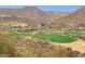 Scenic golf course with lush green fairways and views of the surrounding mountains at 15229 E Marigold Ct, Fountain Hills, AZ 85268