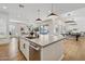 Open-concept kitchen featuring an oversized island with barstool seating and stainless steel appliances at 15229 E Marigold Ct, Fountain Hills, AZ 85268