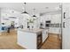 Modern kitchen with island and stainless steel appliances, seamlessly connected to dining and living areas at 15229 E Marigold Ct, Fountain Hills, AZ 85268