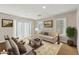 Inviting living room with neutral tones, comfortable seating, and sliding door access to outdoor at 15229 E Marigold Ct, Fountain Hills, AZ 85268