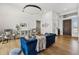 Stylish living room with a blue sofa, modern decor, and hardwood floors providing an inviting atmosphere at 15229 E Marigold Ct, Fountain Hills, AZ 85268