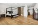 Elegantly appointed main bedroom with a four-poster bed and stylish ensuite bathroom entrance at 15229 E Marigold Ct, Fountain Hills, AZ 85268