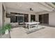 Covered patio with a dining table, ceiling fan, and flatscreen TV perfect for outdoor entertaining at 15229 E Marigold Ct, Fountain Hills, AZ 85268