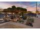 Lush greenery and charming string lights accentuate a backyard gazebo, creating an inviting atmosphere with room to entertain at 1546 W Polk St, Phoenix, AZ 85007