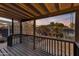 Backyard garden view with patio and cozy landscaping creating a tranquil retreat from the deck of a home at 1546 W Polk St, Phoenix, AZ 85007