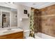 Bathroom with a tiled shower and single vanity sink at 1546 W Polk St, Phoenix, AZ 85007