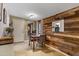 Cozy dining area features a wood-paneled accent wall and seating for four at 1546 W Polk St, Phoenix, AZ 85007