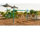 Community playground with swing sets, climbing structures, and slides for hours of fun for children of all ages at 15667 W Mercer Ln, Surprise, AZ 85379