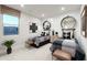 Bedroom featuring two beds with decorative headboards, stylish lighting, and a large window at 15683 W Mercer Ln, Surprise, AZ 85379