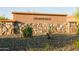 Community entrance sign for Stonefield, nestled amongst desert landscaping and natural stone accents at 15683 W Mercer Ln, Surprise, AZ 85379