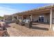 Entertain on this outdoor brick patio with comfortable seating and desert landscape at 15701 W Huron Dr, Sun City West, AZ 85375