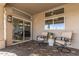 Cozy covered patio with sliding glass door access, and tile flooring at 15701 W Huron Dr, Sun City West, AZ 85375