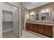 Bathroom features double sinks with granite countertops, tile floors, and a separate toilet room at 15701 W Huron Dr, Sun City West, AZ 85375