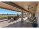 Entertain on this spacious covered patio overlooking a beautiful golf course and desert landscape at 15701 W Huron Dr, Sun City West, AZ 85375