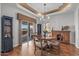 Dining area featuring hardwood floors, a chandelier, and sliding doors to the back patio at 15701 W Huron Dr, Sun City West, AZ 85375